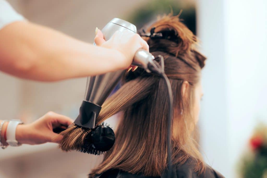 Stylist performing a Blowout